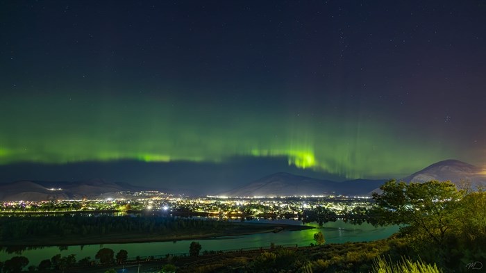 Northern lights shimmer over the hills in Kamloops. 