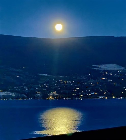 The full harvest moon shines in the Summerland sky.