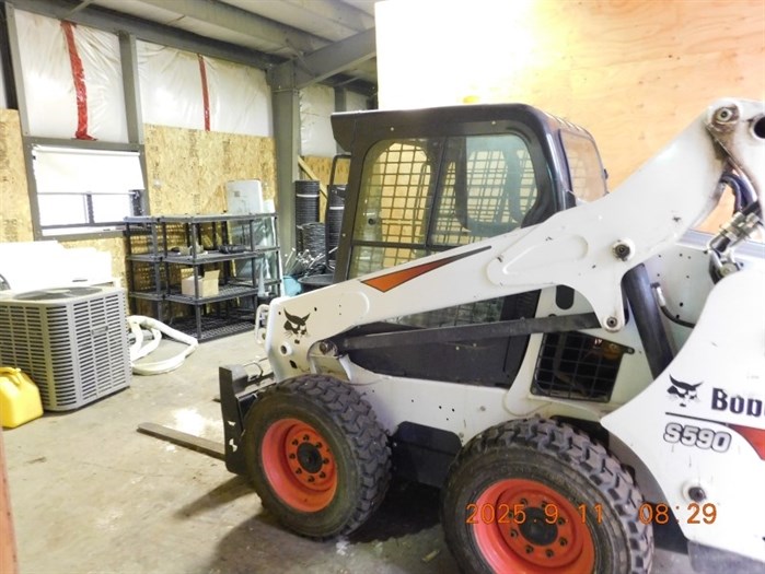 A Bobcat skid steer that had been stolen in Kelowna in 2021 was recovered during the raid in rural Enderby.