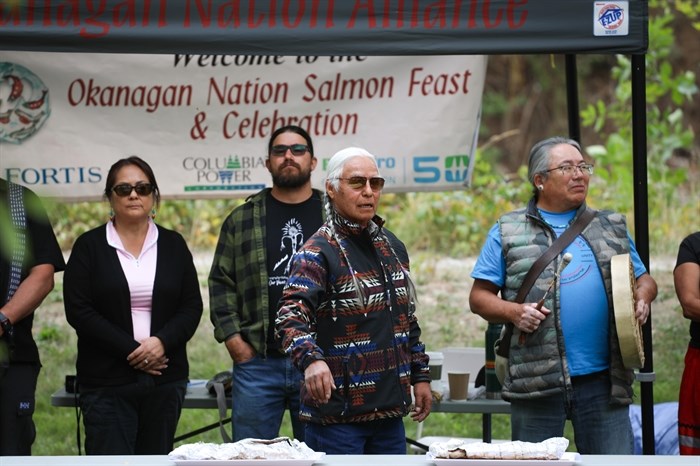 syilx Elder c?qcqalx?qn Arnie Baptist stands before salmon offerings during the Nation’s 2024 feast and celebration at sx???x??nitk? (Okanagan Falls) on Sept. 22.