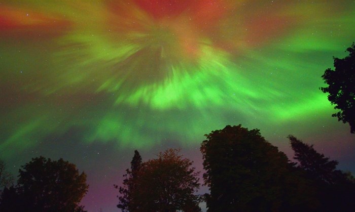 The sky over Trout Creek, Summerland bursts with colourful Northern lights. 