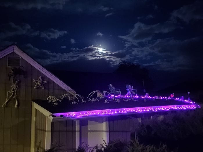 A Vernon resident decorates his rooftops with creepy skeletons for Halloween. 