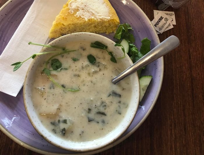 This Greek lemon potato soup with a piece of cornbread was served at The Art We Are in Kamloops in 2022. 