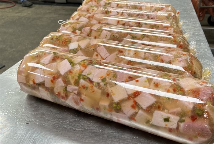 Tubes of vinegar head cheese cure at a deli in Kamloops. 