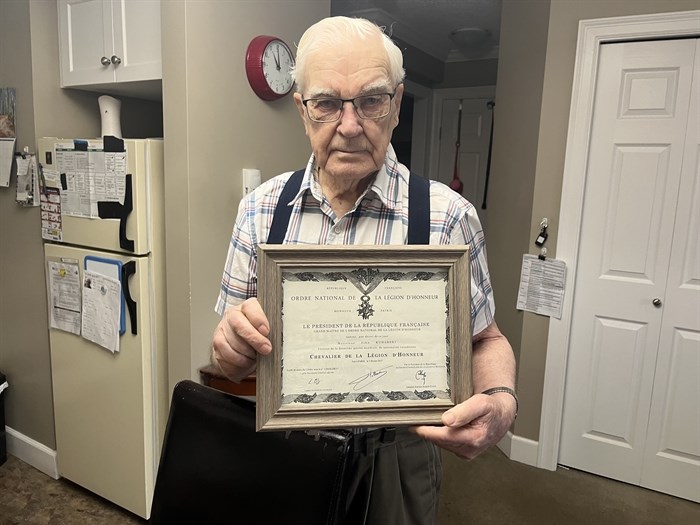 Second World War veteran and Kamloops resident John Kuharski holds his Knight of the French National Order of the Legion of Honour award.