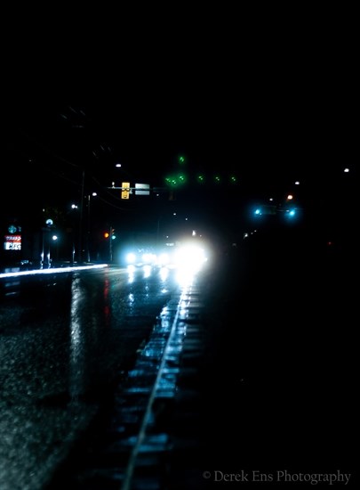 Headlights and rain in Kamloops create a bright, shiny photograph.