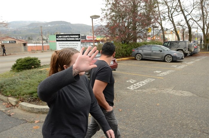 Keisha McCrea covers her face outside the Vernon courtroom, Nov. 21, 2024.