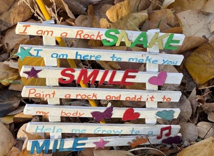 This cheerful sign is posted at the head of a rock snake in Kamloops. 