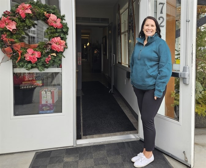 Kamloops Hospice fund developer Sarah Irvine stands at the entrance of the hospice located at 72 Whiteshield Crescent.