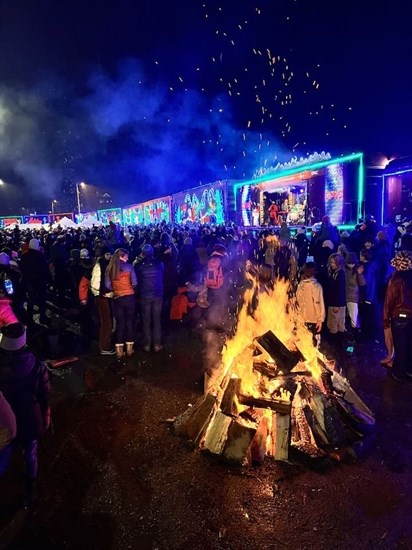 People gathered around a bonfire when the CPKC Holiday Train stopped in Revelstoke on Dec. 16. 