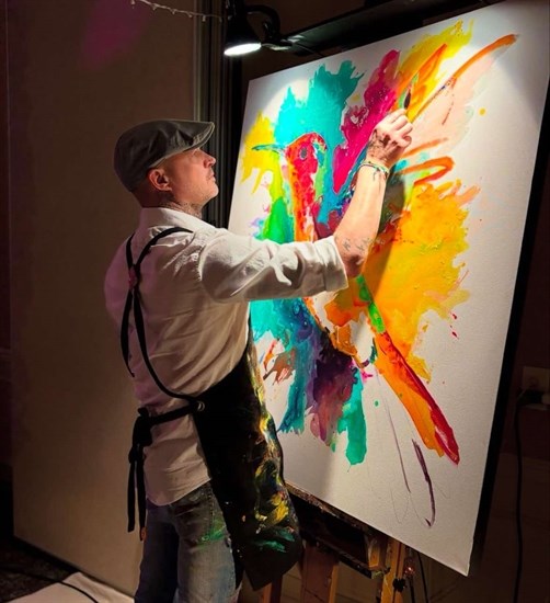 Jordan Perkins paints a hummingbird at a charity event at Allan Brooks Nature Centre in Vernon on Christmas Eve, 2024.