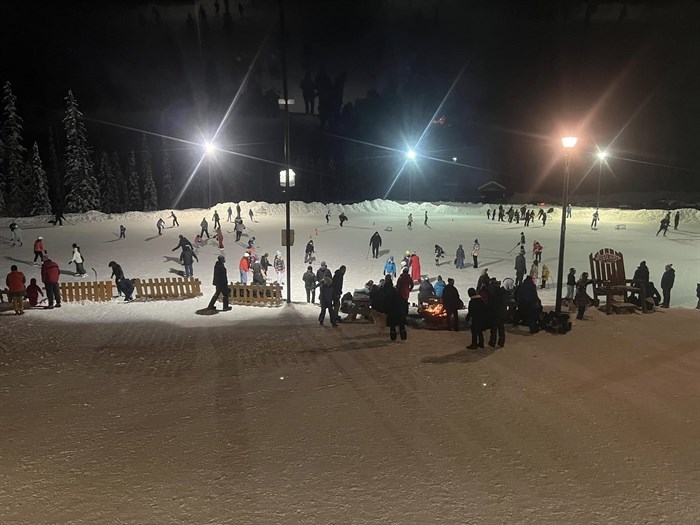 Families are enjoying skating and playing pond hockey on the outdoor rink at Big White Mountain Resort in January. 