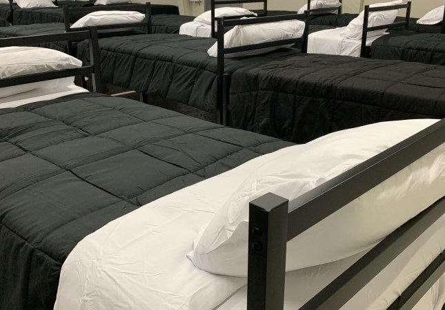 Pathways hosts 44 shelter beds with the men's and women's sides partitioned at the centre of what was once an RV repair shop.