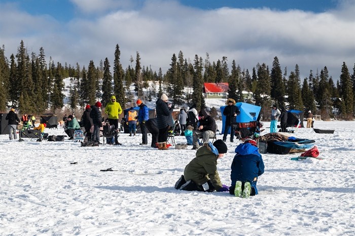 The ice at Walloper Lake near Kamloops is full of families enjoying fishing in January. 