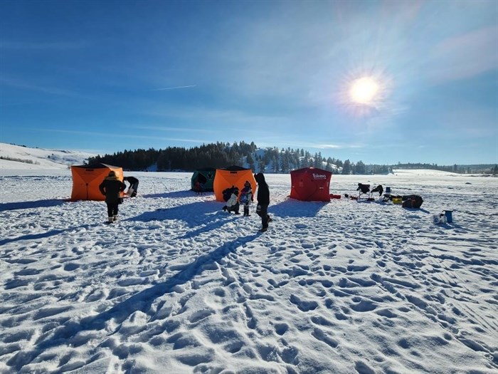 Kids from Kamloops Immigrant Services enjoy a day of ice fishing on Edith Lake in Kamloops on Jan. 26.