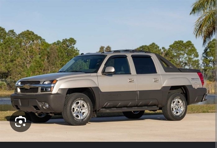 A picture of Robinson's truck with the distinct black panel running on the lower half of the truck.