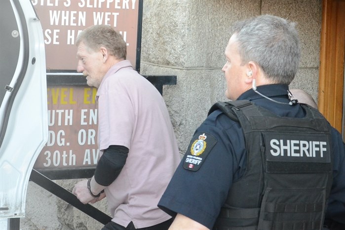 Allan Lockhart leaves the Vernon courthouse on his way to jail.