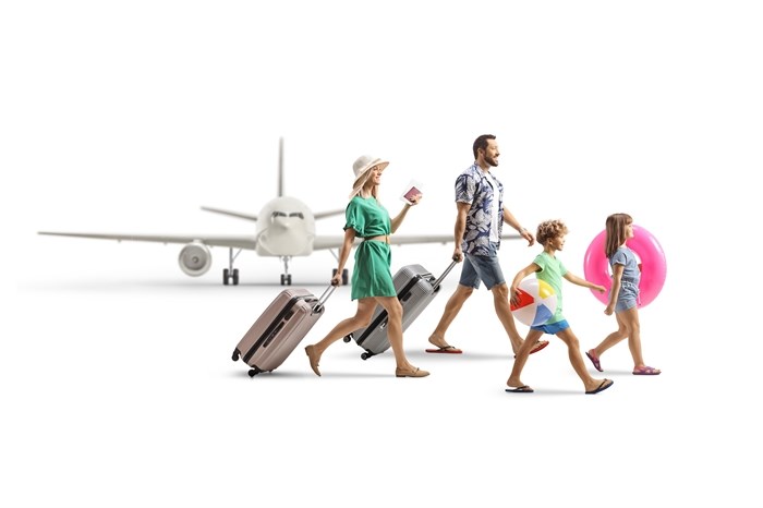 Family boarding a plane for a vacation