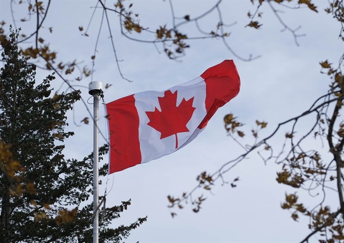 The Canadian flag waves at Riverside Park in Kamloops in the winter. 