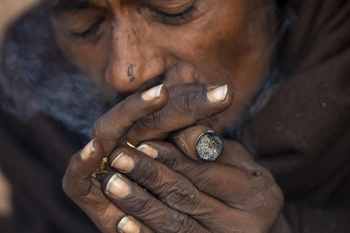 A holy man smokes marijuana at the Pashupatinath Hindu temple during Shivaratri festival in Kathmandu, Nepal, Wednesday, Feb. 26, 2025.