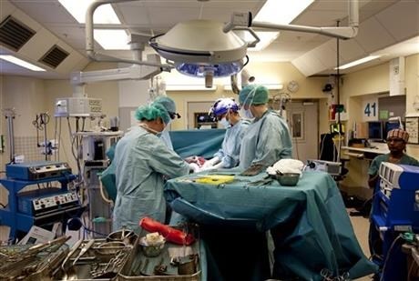 This April 11, 2014 photo made available by the University of Gothenburg, Sweden shows Mats Brannstrom and his team performing a womb transplant.