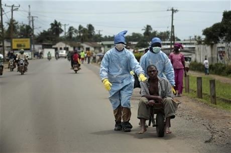 Residents of the St. Paul Bridge neighbourhood take a man suspected of carrying the Ebola virus to the Island Clinic.