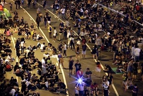 Student pro-democracy protesters continue to occupy the streets near government headquarters, Sunday, Oct. 5, 2014 in Hong Kong.