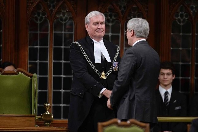 The House of Commons is back in action, kicked off by an exhilarating show of support for Sergeant-at-Arms Kevin Vickers who was among those who opened fire Wednesday on the gunman. Prime Minister Stephen Harper shakes Vickers's hand in the House of Commons this morning in Ottawa.