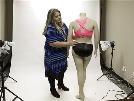Jessica Asmar, owner of Feel Foxy, repositions a mannequin wearing a pair of padded panties.