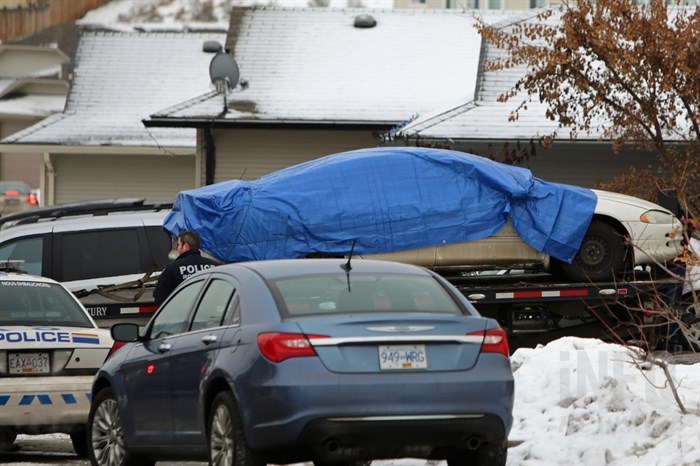 The car involved in the shooting of Cpl. Jean-Rene Michaud was removed from the garage of a house on Raven Drive, Dec. 4, 2014