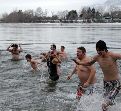 The exit from the icy South Thompson River during the Kamloops Polar Bear Swim, Thursday, Jan. 1, 2015.