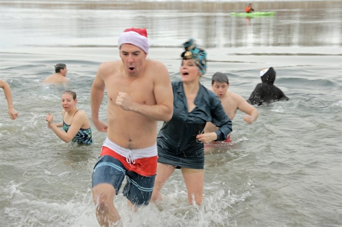 Participants in the Kamloops Polar Bear Swim didn`t linger long on the icy waters of the South Thompson River in Riverside Park, Thursday, Jan. 1, 2015.