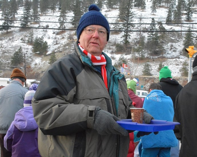 Volunteers were on hand to dispense cups of hot chocolate following the Polar Bear Swim in Peachland, January 1, 2015.