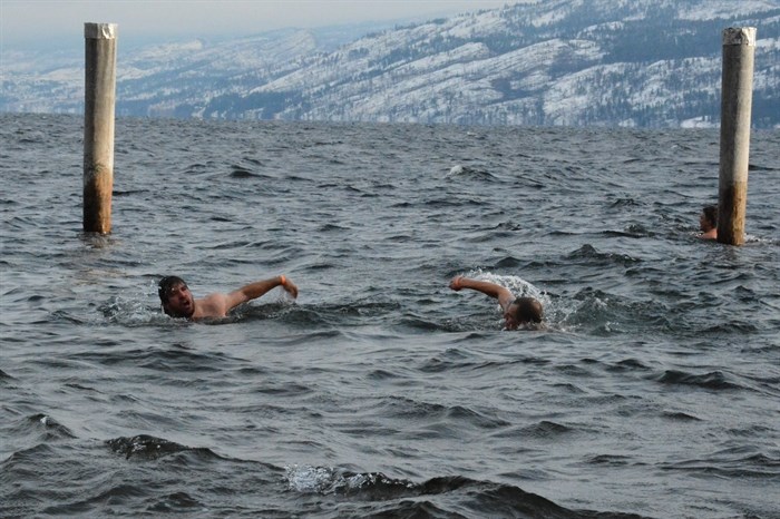 A few swimmers tested themselves by staying in the water for quite some time after the masses had left to warm up, January 1, 2015.