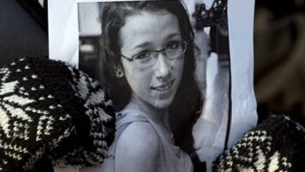 A woman holds a photo at a community vigil to remember Rehtaeh Parsons at Victoria Park in Halifax on April 11, 2013. A man, who was 17 at the time he was charged with child pornography linked to the Parsons case, was given probation during a sentencing hearing Thursday.