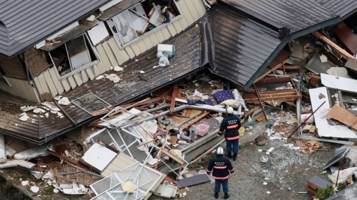 This aerial photo shows collapsed houses after a strong earthquake hit Hakuba, Nagano prefecture, central Japan, Sunday, Nov. 23, 2014.