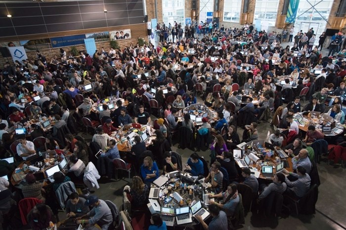 Participants jam into a giant lecture hall in Vancouver, B.C. Saturday, Jan. 24, 2015 to take part in HTML500, a course which teaches computer coding skills.