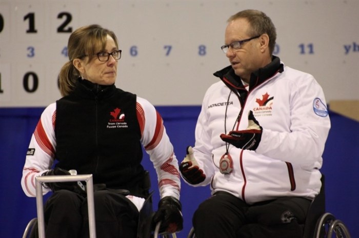 Vernon's Sonja Gaudet and Dennis Thiessen from Sanford, Man. discuss strategy at the World Wheelchair Curling Championships in Finland, Saturday, Feb. 7, 2015.