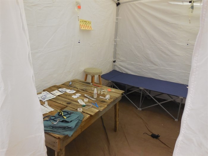 A medical tent, complete with a rat, shows the stark reality of medical care in many countries around the world.