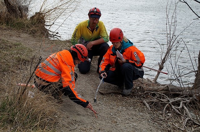 Teams identify tracks and find tracks to indicate direction of travel. Shown, left to right: Sil Huber (PENSAR), Scott Hare (Princeton Search and Rescue) and Christy Giles (PENSAR).