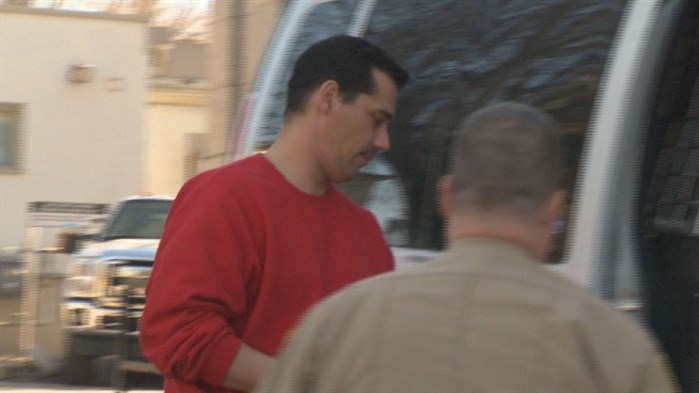 Ryan Hampton is escorted from the Vernon courthouse.