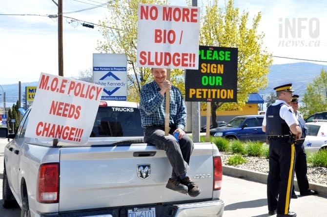Protest continues outside premier's constituency office in West Kelowna.