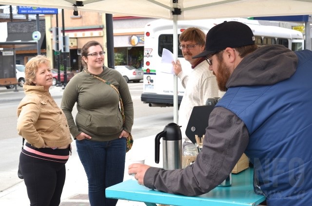 Andrew McWilliam serves a cup of coffee out of his mobile Ratio Coffee food truck outside the pop-up Vernon art gallery on 31 Avenue. 