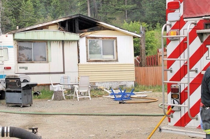 Firefighters mopped up the blaze that consumed a home at the Iron Mask Mobile Home Park June 1 