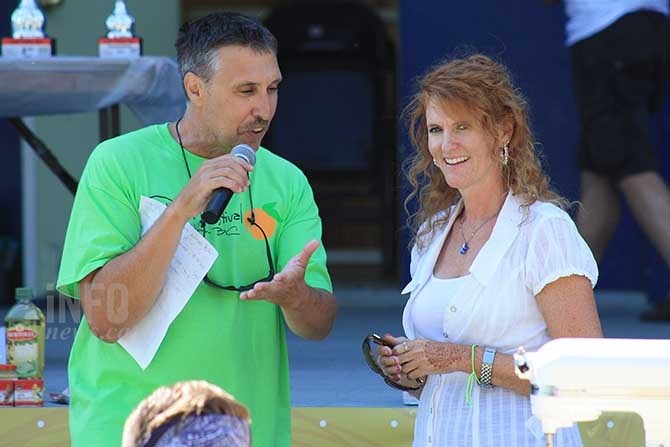 SOcountry radio MC Dennis Walker speaks with Downtown Penticton Association Executive Director Kerry Milton during the Chefs Cook Off in Gyro Park Friday, August 7, 2015.