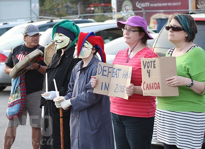 Protesters were lined up at the entrance to Brutus Truck Bodies on Okanagan Avenue East following Harper's visit to Penticton this evening, Sunday, Sept.13.