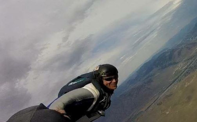 Hurlbut flying in one of his wingsuits.	