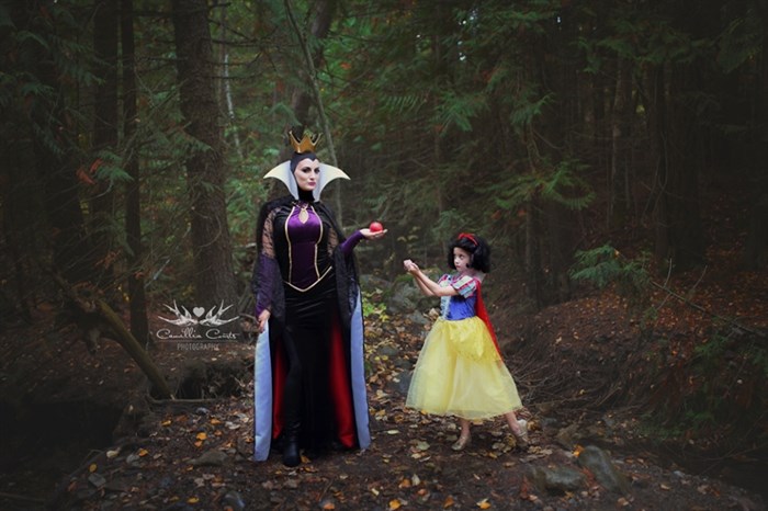 On special occasions like Halloween, Courts also has fun dressing up. Here, she's the evil queen and Layla is Snow White. 
