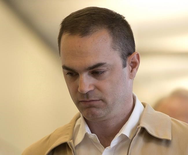 FILE - Guy Turcotte arrives at the courthouse on September 28, 2015 in Saint Jerome, Que. Turcotte has been found guilty of second-degree murder in the stabbing deaths of his two young children more than six years ago.