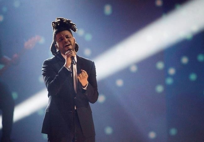 FILE PHOTO - The Weeknd performs during the 2015 Juno Awards, in Hamilton, Ont., on March 15, 2015.